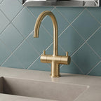 Brushed brass twin lever deck mounted basin tap