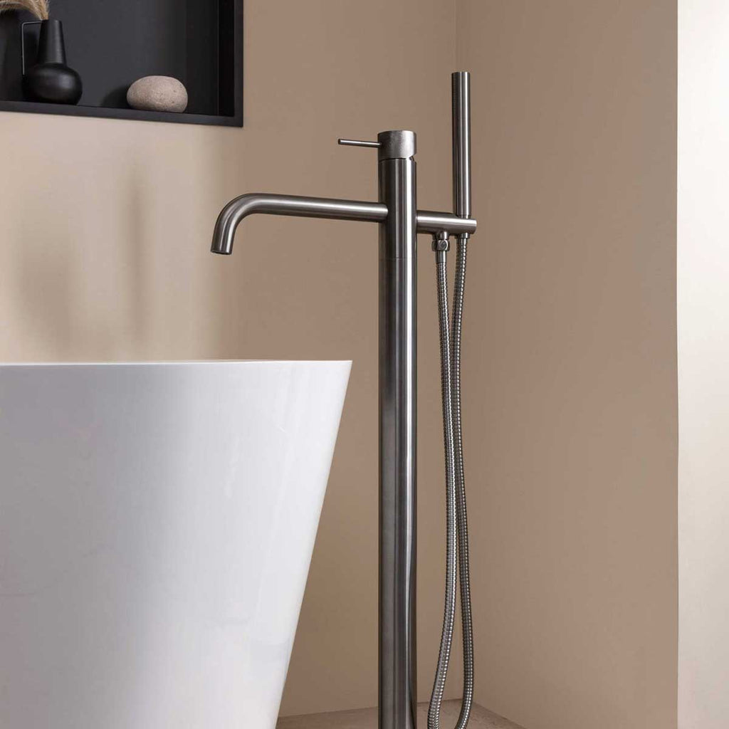 Floor standing bath tap with shower brushed black