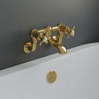 Traditional gold wall mounted bath filler tap