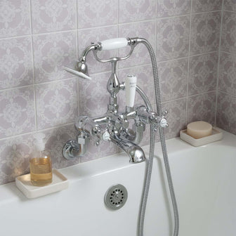 Traditional wall mounted bath mixer tap with shower attachment - chrome  Main image