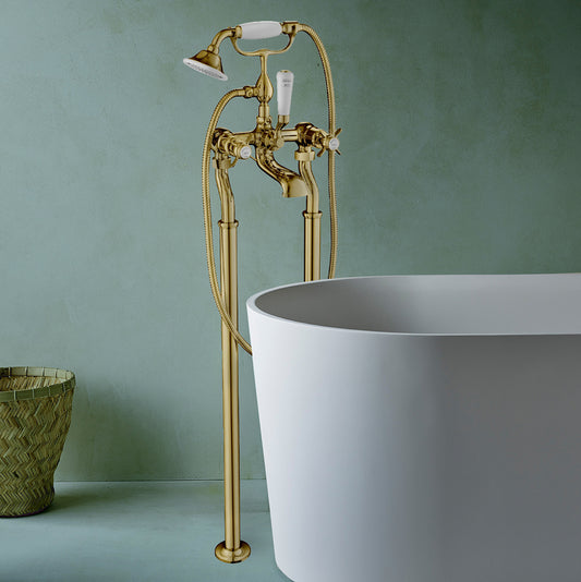 Gold Freestanding Bath Shower Mixer With Kit installed in a modern bathroom 1000