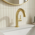 brushed brass basin tap with side lever