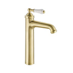 brushed brass tall basin tap with white ceramic lever