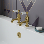 gold bath pillar taps with lever handles