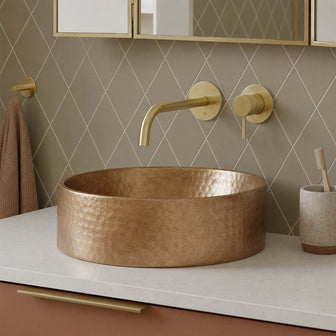 knurled brushed brass wall mounted basin tap Main image