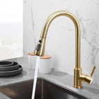 Polished gold kitchen tap with pull out spray