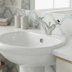 traditional basin mixer tap with pop up waste and two pinch handles