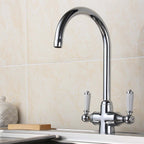traditional kitchen tap with white levers 