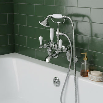 wall mounted bath  mixer tap with white levers and traditional telephone shower handset Main image
