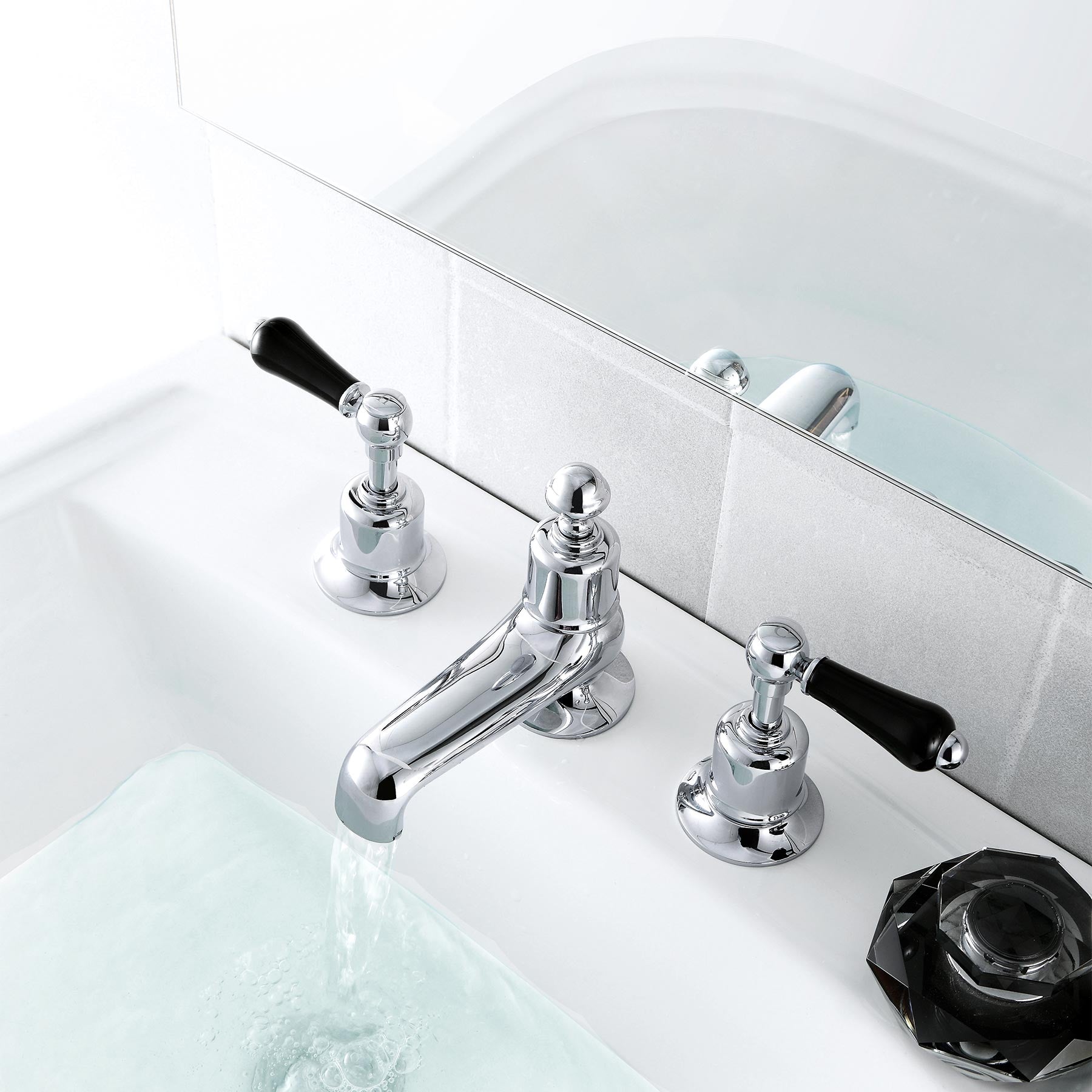 Chester Black Lever 3 Hole Deck Mounted Basin Mixer. Designed with tradition in mind, this three-part tap has a central spout to deliver water at the perfect temperature due to the thermostatic controls.