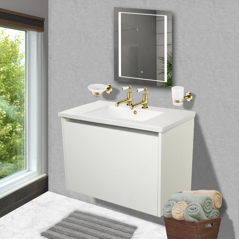 Gold-basin-taps-and-gold-bathroom-accessories-installed-in-a-modern-bathroom