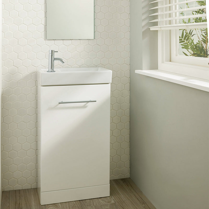White Floor Mounted Vanity Unit with Single Door and Basin and single lever basin mixer tap in a white painted bathroom