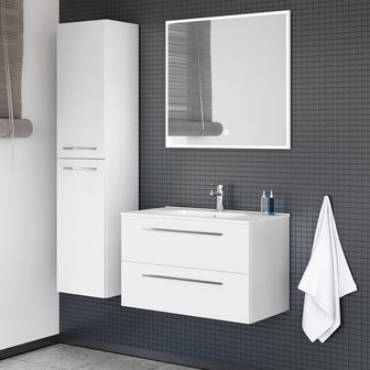 White double door bathroom side cabinet on a bathroom wall with matching white vanity unit and large bathroom mirror Main image