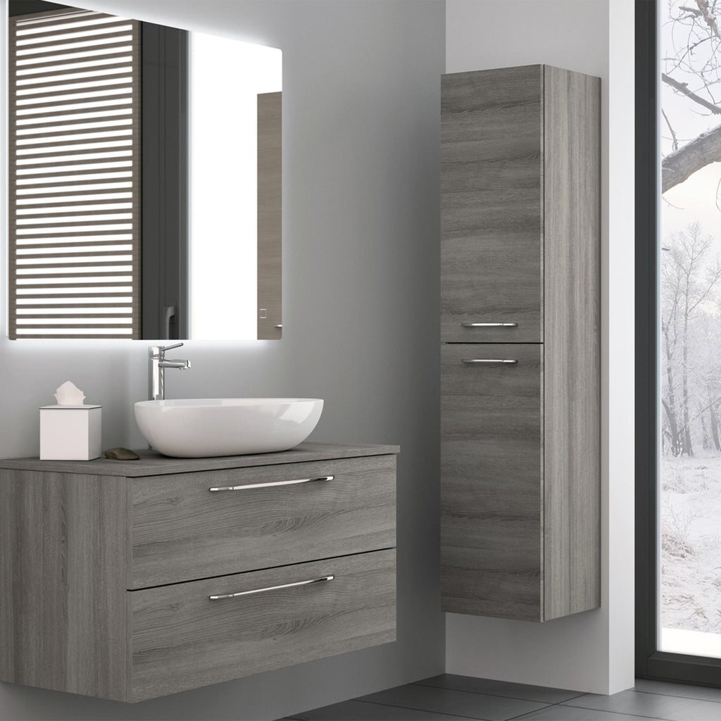 Grey double door side cabinet on a bathroom wall with matching wall mounted bathroom shelves cabinet, white basin and basin sink mixer tap on top and large bathroom mirror above it.