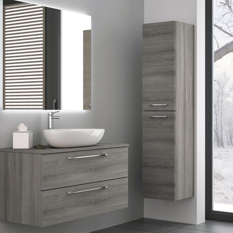 Grey double door side cabinet on a bathroom wall with matching wall mounted bathroom shelves cabinet, white basin and basin sink mixer tap on top and large bathroom mirror above it.
