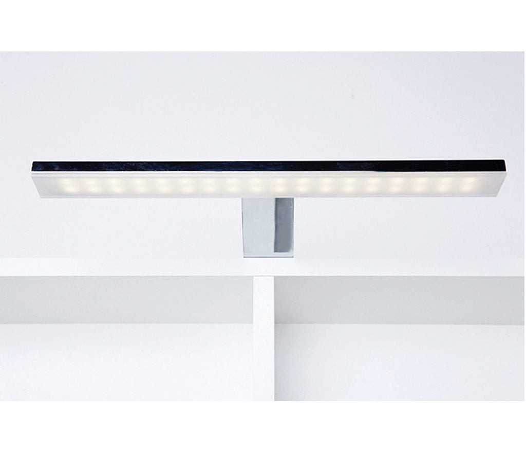 Bathroom mirror cabinet with light and shaver plug shinning light above the cabinet