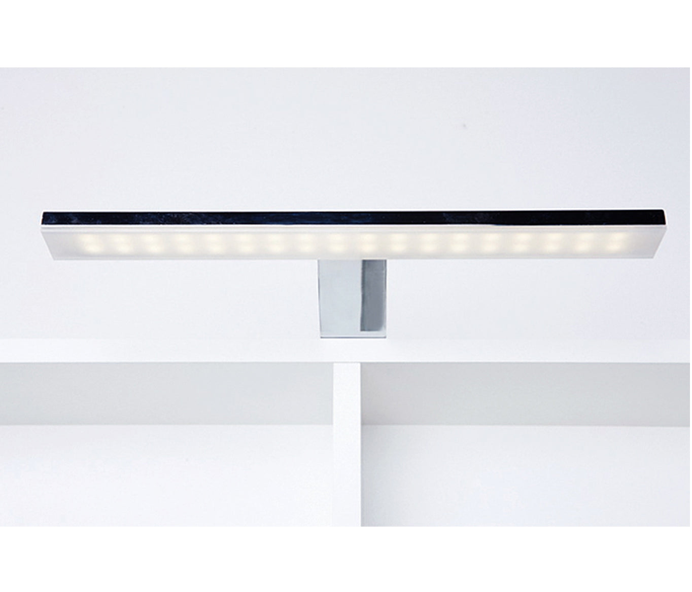 Bathroom mirror cabinet with light and shaver plug shinning light above the cabinet